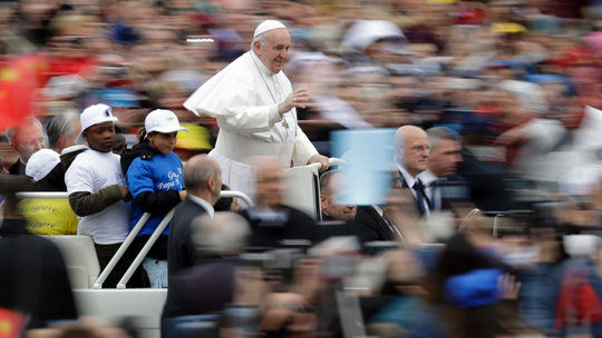 Pope gives joyride to migrant kids newly arrived in Italy