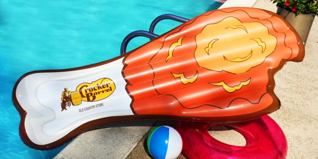 The chain designed the fried-chicken pool float for its anniversary, which officially takes place in September.