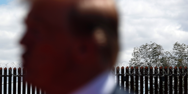 FILE - In this Friday April 5, 2019, file photo, President Donald Trump speaks as he visits a new section of the border wall with Mexico in Calexico, Calif. A federal judge in California has blocked Trump from building sections of his long-sought border wall with money secured under his declaration of a national emergency. U.S. District Judge Haywood Gilliam Jr. on Friday, May 24, 2019, immediately halted the administration's efforts to redirect military-designated funds to build sections of wall on the Mexican border. (AP Photo/Jacquelyn Martin, File)