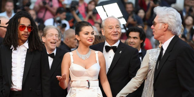 Actors Luka Sabbat, from left, Selena Gomez, Bill Murray, and director Jim Jarmusch pose for photographers upon arrival at the opening ceremony and the premiere of the film 'The Dead Don't Die' at the 72nd international film festival, Cannes, southern France, Tuesday, May 14, 2019. (AP)