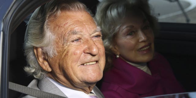 In this Sept. 2013, file photo, former Australian Prime Minister Bob Hawke, left, and his wife Blanche d'Alpuget arrive at the Australian Labor Party's campaign launch in Brisbane, Australia. Hawke, Australia's 23rd prime minister, has died in Sydney at age 89.