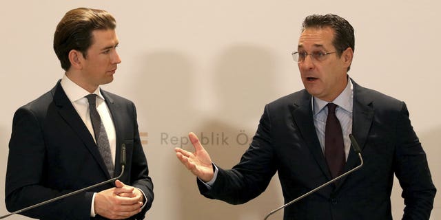 FILE - In this Tuesday, Dec. 4, 2018 file photo, Austria's Chancellor Sebastian Kurz and Austrian Vice Chancellor Heinz-Christian Strache, from left, hold a joint press conference after one year government in Austria at the Hofburg palace in Vienna, Austria. Two German newspapers are reporting that the head of Austria's far-right Freedom Party offered government contracts in return for support for his party from a potential Russian donor shortly before the Austrian's 2017 parliamentary election.