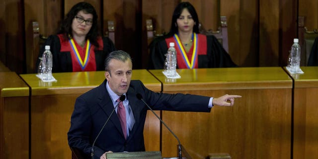 FILE - In this March 3, 2017 file photo, Venezuela's Vice President Tareck El Aissami, center, delivers his state of the nation report at the Supreme Court in Caracas, Venezuela. Charges were unsealed Friday, March 8, 2019 against the former Venezuelan vice president in New York federal court as authorities accused him of using his office to aid international drug traffickers.