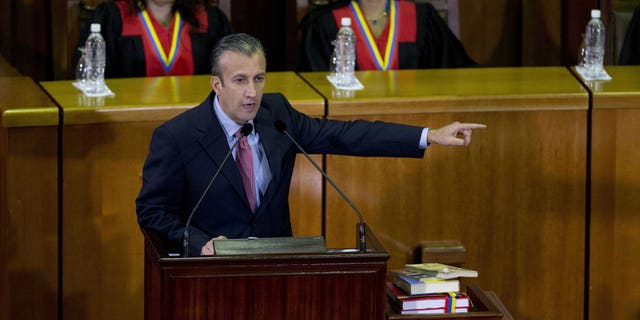 FILE - In this March 3, 2017 file photo, Venezuela's Vice President Tareck El Aissami, center, delivers his state of the nation report at the Supreme Court in Caracas, Venezuela. Charges were unsealed Friday, March 8, 2019 against the former Venezuelan vice president in New York federal court as authorities accused him of using his office to aid international drug traffickers.