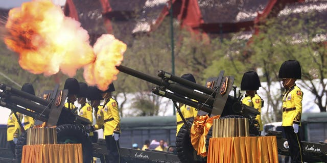 Royal Guards fire cannons in honour of Thailand's King Maha Vajiralongkorn Saturday, May 4, 2019, in Bangkok, Thailand.