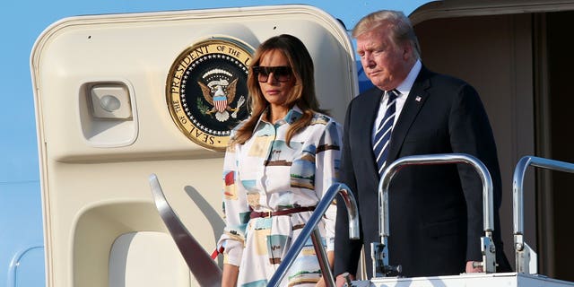 U.S. President Donald Trump, right, and first lady Melania Trump arrive at the Haneda International Airport Saturday, May 25, 2019, in Tokyo. (Associated Press)