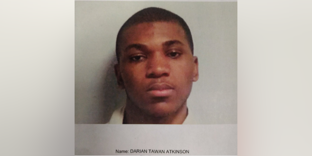Darian Tawan Atkinson, 19, is accused of killing a Mississippi police officer outside the department's headquarters on Sunday night.