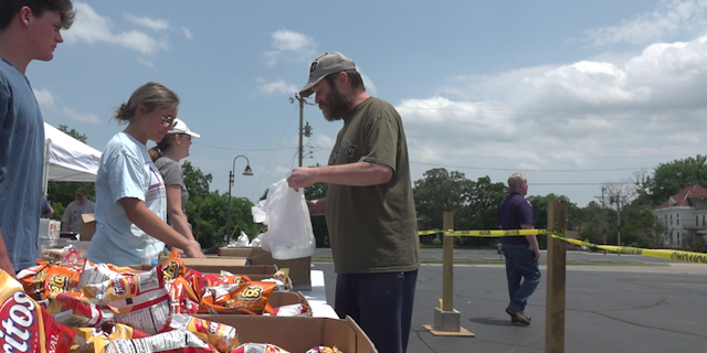 Volunteers at First Baptist Church in Fort Smith help distribute food