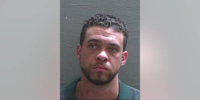 Andrew Ross-Celaius, 37, was found hanging in his jail cell Wednesday but was still alive, according to reports. (Escambia County Sheriff’s Office)