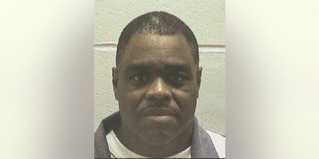 FILE - This undated file photo made available by the Georgia Department of Correction shows Scotty Garnell Morrow, who is set to die Thursday, May 2, 2019. When Morrow killed his ex-girlfriend and her friend nearly 25 years ago, his actions were spontaneous and emotionally fueled and shouldn't be punished by death, his lawyers argue. The State Board of Pardons and Paroles has scheduled a clemency hearing for Wednesday, May 1, 2019, and on Tuesday released a declassified clemency application submitted by Morrow's lawyers. (Georgia Department of Corrections via AP)