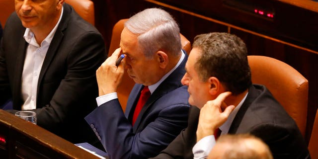Israeli Prime Minister Benjamin Netanyahu before voting in the Knesset, Israel's parliament in Jerusalem, Wednesday, May 29, 2019. Israel's parliament has voted to dissolve itself, sending the country to an unprecedented second snap election this year as Prime Minister Benjamin Netanyahu failed to form a governing coalition before a midnight deadline.