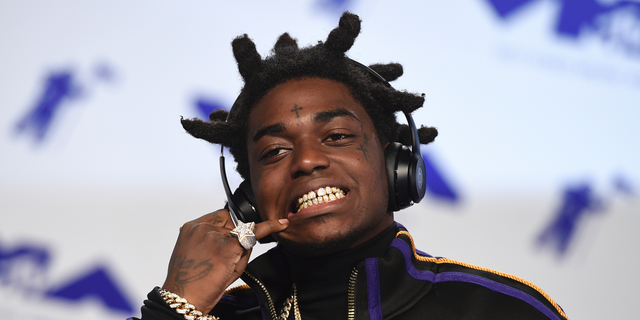 Kodak Black arrives at the MTV Video Music Awards at The Forum in Inglewood, Calif. Officials say Florida rapper Kodak Black was arrested on federal and state weapons charges just before he was to perform at a hip-hop festival. The U.S. Marshals office says in a news release that the 21-year-old Black was taken into custody Saturday, May 11, 2019 at the Rolling Loud Music Festival at Hard Rock Stadium in Miami Gardens. The statement didnât elaborate.
