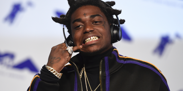 Kodak Black arrives at the MTV Video Music Awards at The Forum in Inglewood, Calif. Officials say Florida rapper Kodak Black was arrested on federal and state weapons charges just before he was to perform at a hip-hop festival. The U.S. Marshals office says in a news release that the 21-year-old Black was taken into custody Saturday, May 11, 2019 at the Rolling Loud Music Festival at Hard Rock Stadium in Miami Gardens. The statement didn’t elaborate.