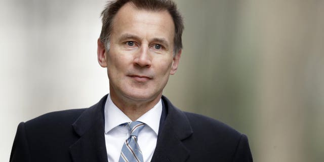 FILE - In this Wednesday, March 13, 2019 file photo, Britain's Foreign Secretary Jeremy Hunt arrives for a cabinet meeting at 10 Downing Street in London. Prime Minister Theresa May’s announcement that she will leave 10 Downing Street has set off a fierce competition to succeed her as Conservative Party leader _ and as the next prime minister.