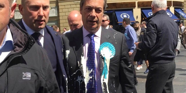 Brexit Party leader Nigel Farage after being hit with a milkshake during a campaign walkabout for the upcoming European elections in Newcastle, England, Monday May 20, 2019.