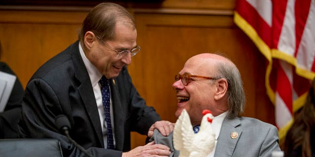 Judiciary Committee Chairman Jerrold Nadler, D-N.Y., left, laughs with Rep. Steve Cohen, D-Tenn., right, after Cohen arrived with a bucket of fried chicken and a prop chicken as Attorney General William Barr did not appear before a House Judiciary Committee hearing. (AP Photo/Andrew Harnik)