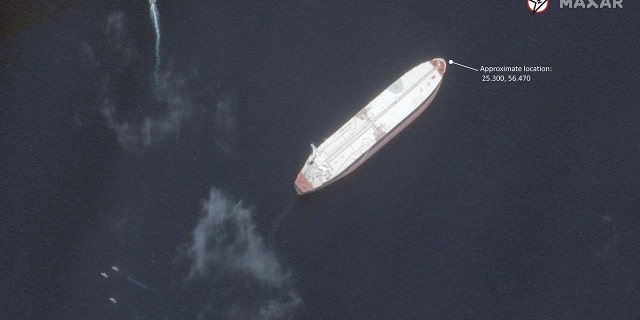 This satellite image provided by Maxar Technologies shows the Saudi-flagged oil tanker Amjad off the coast of Fujairah, United Arab Emirates, Monday, May 13, 2019. As many as four oil tankers anchored in the Mideast were damaged in what Gulf officials described Monday as a "sabotage" attack off the coast of the United Arab Emirates. (Satellite image ©2019 Maxar Technologies via AP)