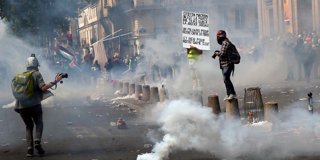 Tear gas canisters lie on the ground during a May Day demonstration in Paris, Wednesday, May 1, 2019. Brief scuffles between police and protesters have broken out in Paris as thousands of people gather for May Day rallies under tight security measures. Police used tear gas to control the crowd gathering near Paris' Montparnasse train station. (AP Photo/Francois Mori)