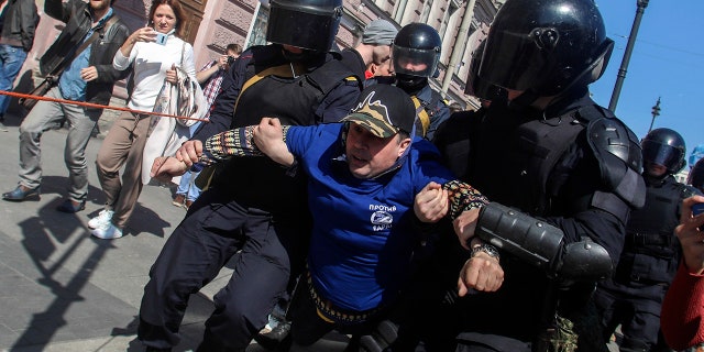 Insurgent police officers arrested demonstrators during a rally in St. Petersburg, Russia, Wednesday, May 1, 2019.