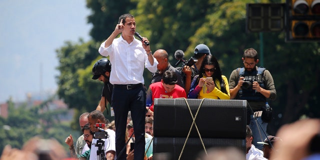 Opposition leader Juan Guaidó speaks to supporters in Caracas, Venezuela, Wednesday, May 1, 2019. Thousands gathered to demand President Nicolas Maduro's ouster in what could be another critical day in the nation's struggle between a widely detested socialist government and an opposition backed by powerful allies like the United States but unable to secure the loyalty of key factions like the military. (AP Photo/Fernando Llano)