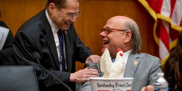 Judiciary Committee Chairman Jerrold Nadler, D-N.Y., left, laughs with Rep. Steve Cohen, D-Tenn., right, after Cohen arrived with a bucket of fried chicken and a prop chicken at a House Judiciary Committee hearing on Capitol Hill in Washington, Thursday, May 2, 2019. (AP Photo/Andrew Harnik)