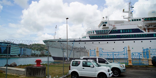 Health officials said they will board the ship (pictured) when it arrives early Saturday and assess who has been vaccinated or had the disease previously.