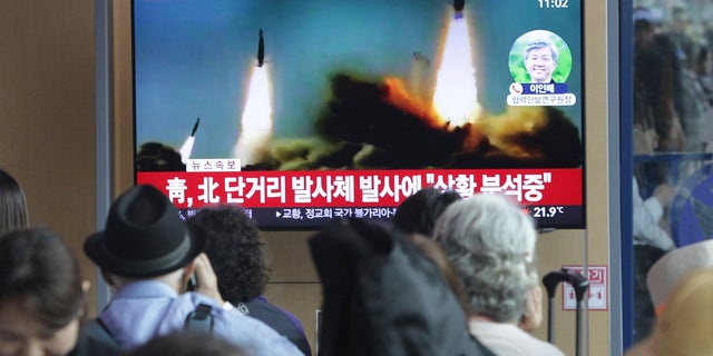 People watch a TV showing footage of North Korea's missile launch during a news program at the Seoul Railway Station in Seoul, South Korea on Saturday. (AP Photo/Ahn Young-joo)