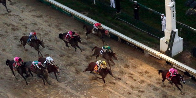 Luis Saez first straddles maximum safety ahead of Flavien Prat, followed by Flavien Prat at Country House in the 145th Kentucky Derby at Churchill Downs on Saturday, May 4, 2019 in Louisville, Kentucky. Country House was declared winner after Maximum Safety was disqualified as a result of a review by the stewards. (Associated Press)