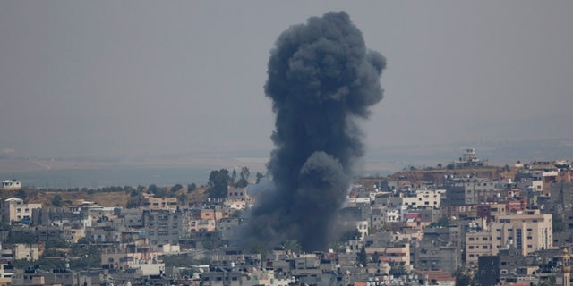 Smoke rises from an explosion after an Israeli airstrike in Gaza City, Sunday, May 5, 2019. The Israeli military said Sunday it had responded to 450 rockets fired from Gaza with over 250 airstrikes against the besieged Palestinian enclave. (AP Photo/Hatem Moussa)