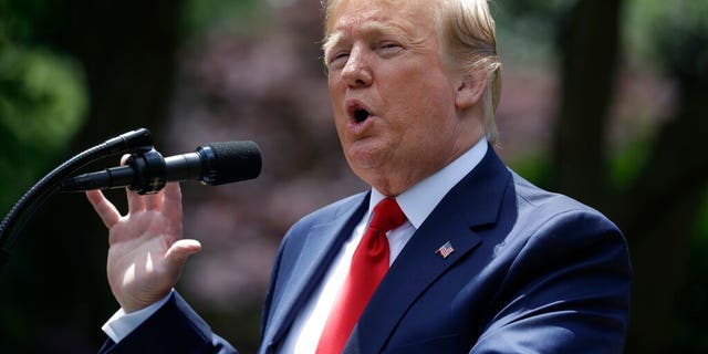 President Donald Trump speaks during the presentation of the Commander-in-Chief's Trophy to the U.S. Military Academy at West Point football team, in the Rose Garden of the White House, Monday, May 6, 2019, in Washington.