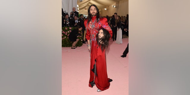 Jared Leto, holding a model of his own head, attends the 2019 Met Gala in New York City.