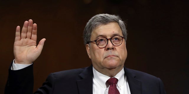 Attorney General William Barr is sworn in to testify during a hearing on Capitol Hill. (Associated Press)