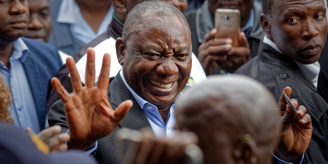 President Cyril Ramaphosa greets supporters after casting his vote at the Hitekani Primary School in Soweto, Johannesburg, South Africa Wednesday, May 8, 2019.