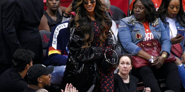 Beyonce walks onto the court during the second half of Game 6 (AP Photo/Eric Christian Smith)