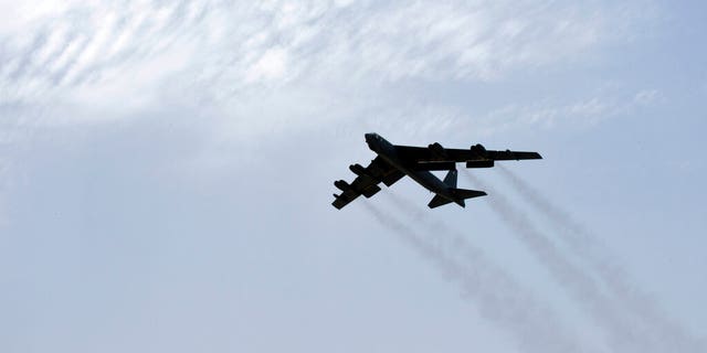 In this Sunday, May 12, 2019 photo released by the U.S. Air Force, a U.S. Air Force B-52H Stratofortress aircraft assigned to the 20th Expeditionary Bomb Squadron takes off from Al Udeid Air Base, Qatar.