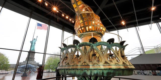The original torch and flame are displayed in the new Statue of Liberty Museum, on Liberty Island, in New York, Monday, May 13, 2019.