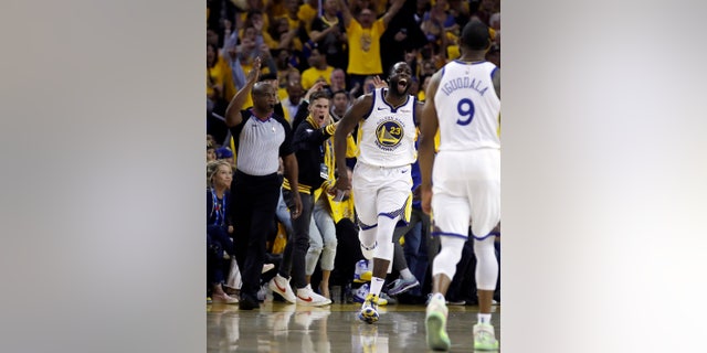 Golden State Warriors' Draymond Green (23) celebrates a score against the Portland Trail Blazers during the second half of Game 1 of the NBA basketball playoffs Western Conference finals Tuesday, May 14, 2019, in Oakland, Calif.