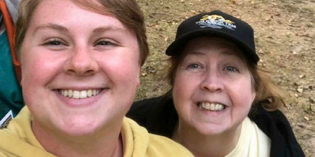 In this 2018 photo provided by Virginia Black, Alex Black, left, poses for a photo with her aunt Virginia. Alex Black was killed in November 2018 when she came face to face with an escaped lion just 10 days into her unpaid internship at the Conservators Center in Burlington, N.C. (Virginia Black via AP)
