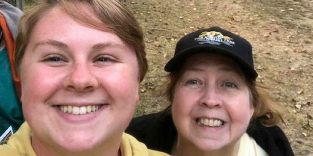 In this 2018 photo provided by Virginia Black, Alex Black, left, poses for a photo with her aunt Virginia. Alex Black was killed in November 2018 when she came face to face with an escaped lion just 10 days into her unpaid internship at the Conservators Center in Burlington, N.C. (Virginia Black via AP)