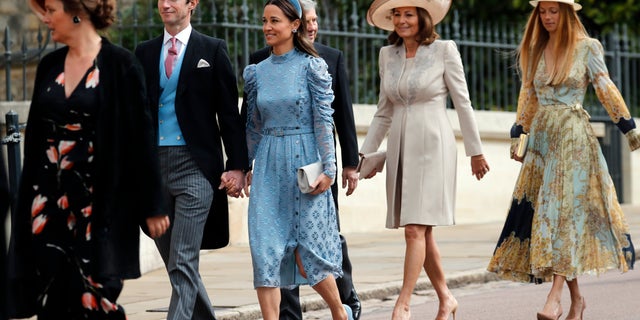 James Matthews, second left, and his wife Pippa, third left, arrive for the wedding of Lady Gabriella Windsor and Thomas Kingston at St George's Chapel, Windsor Castle, near London, England, Saturday, May 18, 2019. (AP Photo/Frank Augstein, Pool)