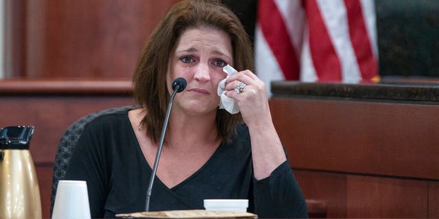 Amber Jones cries from the witness stand while being questioned by 11th Circuit deputy Solicitor Suzanne Mayes during the trial of her ex husband, Tim Jone.