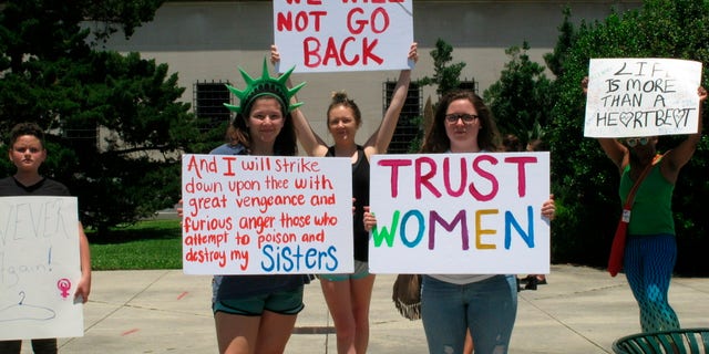 Pro-choice women protest at the Louisiana Capitol, where lawmakers passed bill that would ban abortion as early as six weeks of pregnancy, on Tuesday, May 21, 2019, in Baton Rouge, La. (AP Photo/Melinda Deslatte)