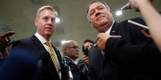 Acting Defense Secretary Patrick Shanahan, left, and Secretary of State Mike Pompeo speak to members of the media after a classified briefing for members of Congress on Iran, Tuesday, May 21, 2019, on Capitol Hill in Washington. (AP Photo/Patrick Semansky)