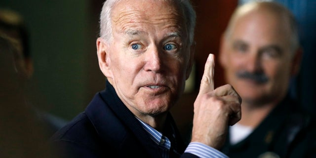 In this May 13, 2019, photo, former vice president and Democratic presidential candidate Joe Biden interacts with a supporter during a campaign stop at the Community Oven restaurant in Hampton, N.H. (AP Photo/Michael Dwyer, File)
