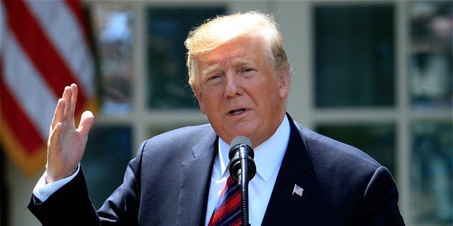In this May 16, 2019, file photo, President Donald Trump speaks in the Rose Garden of the White House in Washington. A judge is poised to hear oral arguments Wednesday, May 22, 2019, over Trump's effort to block congressional subpoenas seeking financial records from two banks. (AP Photo/Manuel Balce Ceneta, File)