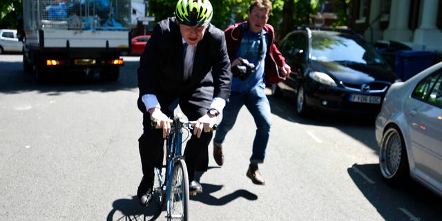 Politician Boris Johnson leaves his home, on the day of the European Parliament elections, in London, Thursday May 23, 2019.