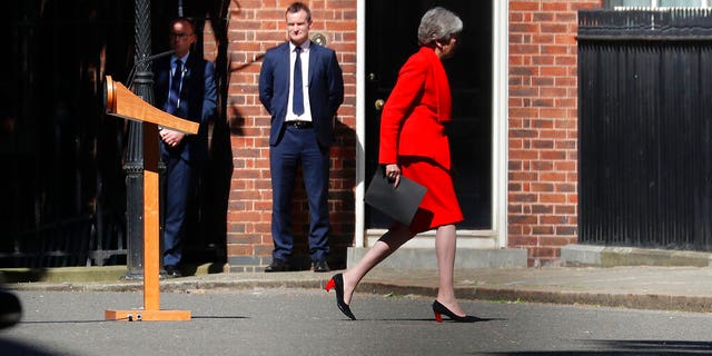 Britain's Prime Minister Theresa May walks back after addressing the media in Downing Street in London, Friday, May 24. May has announced that will step down as U.K. Conservative Party leader on June 7, sparking a contest to become Britain's next prime minister.