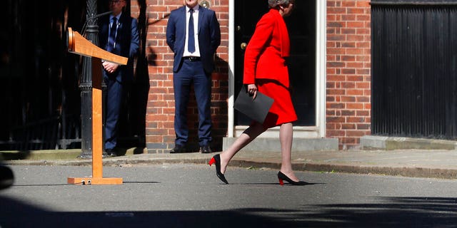 Britain's Prime Minister Theresa May walks back after addressing the media in Downing Street in London, Friday, May 24. May has announced that will step down as U.K. Conservative Party leader on June 7, sparking a contest to become Britain's next prime minister.