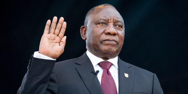 South African President Cyril Ramaphosa, right, takes the Oath of Office at the Loftus Versfeld Stadium in Pretoria, South Africa. (Yeshiel Panchia/Pool Photo via AP)