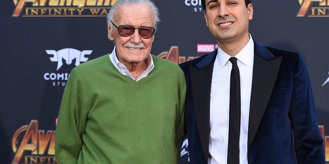 In this April 23, 2018, file photo, Stan Lee, left, and Keya Morgan arrive at the world premiere of "Avengers: Infinity War" in Los Angeles. Morgan, the former business manager of Lee has been arrested on elder abuse charges involving the late comic book icon. (Photo by Jordan Strauss/Invision/AP, File)